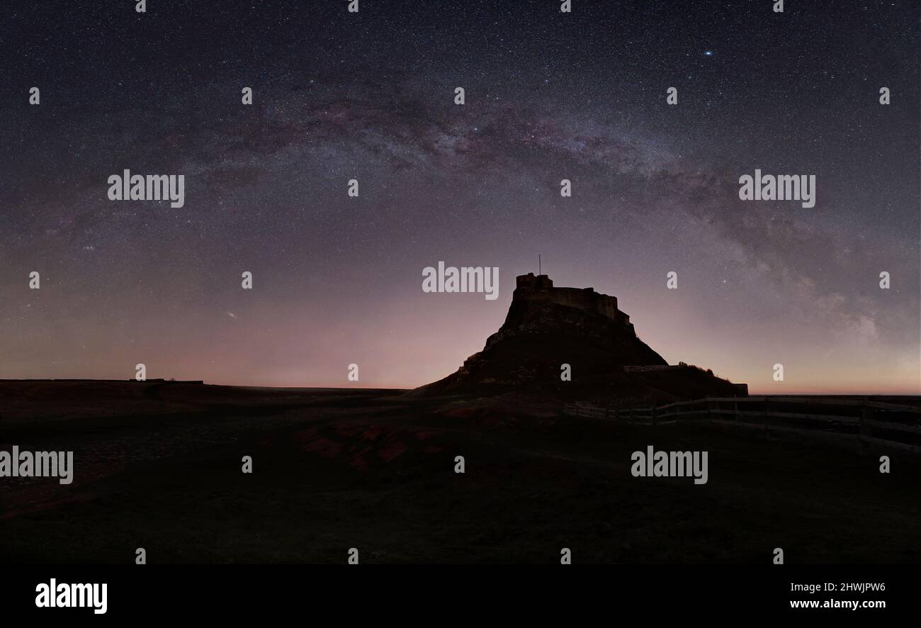 The Milky Way arching over Lindisfarne Castle on Lindisfarne (Holy Island), Berwick-Upon-Tweed Stock Photo