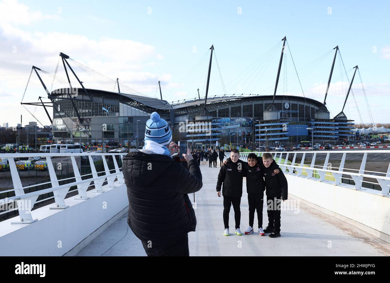 Manchester, England, 6th March 2022.   Fans arriving at the stadium pose for pictures before the Premier League match at the Etihad Stadium, Manchester. Picture credit should read: Darren Staples / Sportimage Credit: Sportimage/Alamy Live News Stock Photo