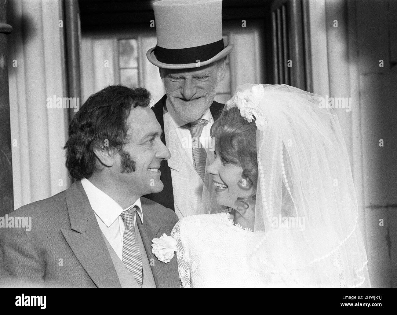 Steptoe and Son, film released 1972, starring Wildred Brambell as Albert Steptoe, Harry H Corbett as his son Harold Steptoe, and Carolyn Seymour as wife Zita, pictured on location at St John's Church, Ladbroke Grove, London, Thursday 28th October 1971. Stock Photo