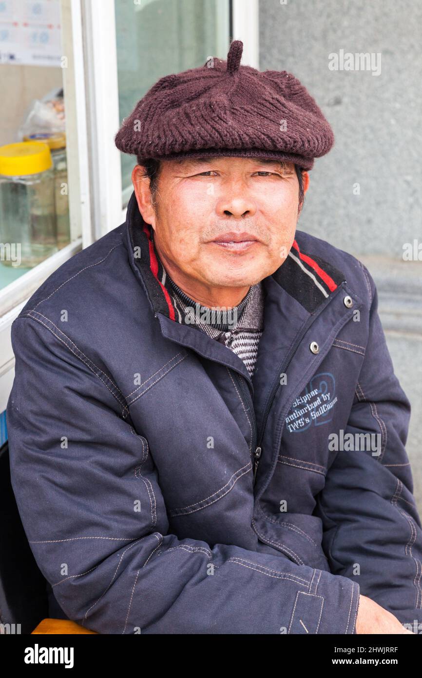 Portrait of a man with a woolen beret. Jiashan, China Stock Photo