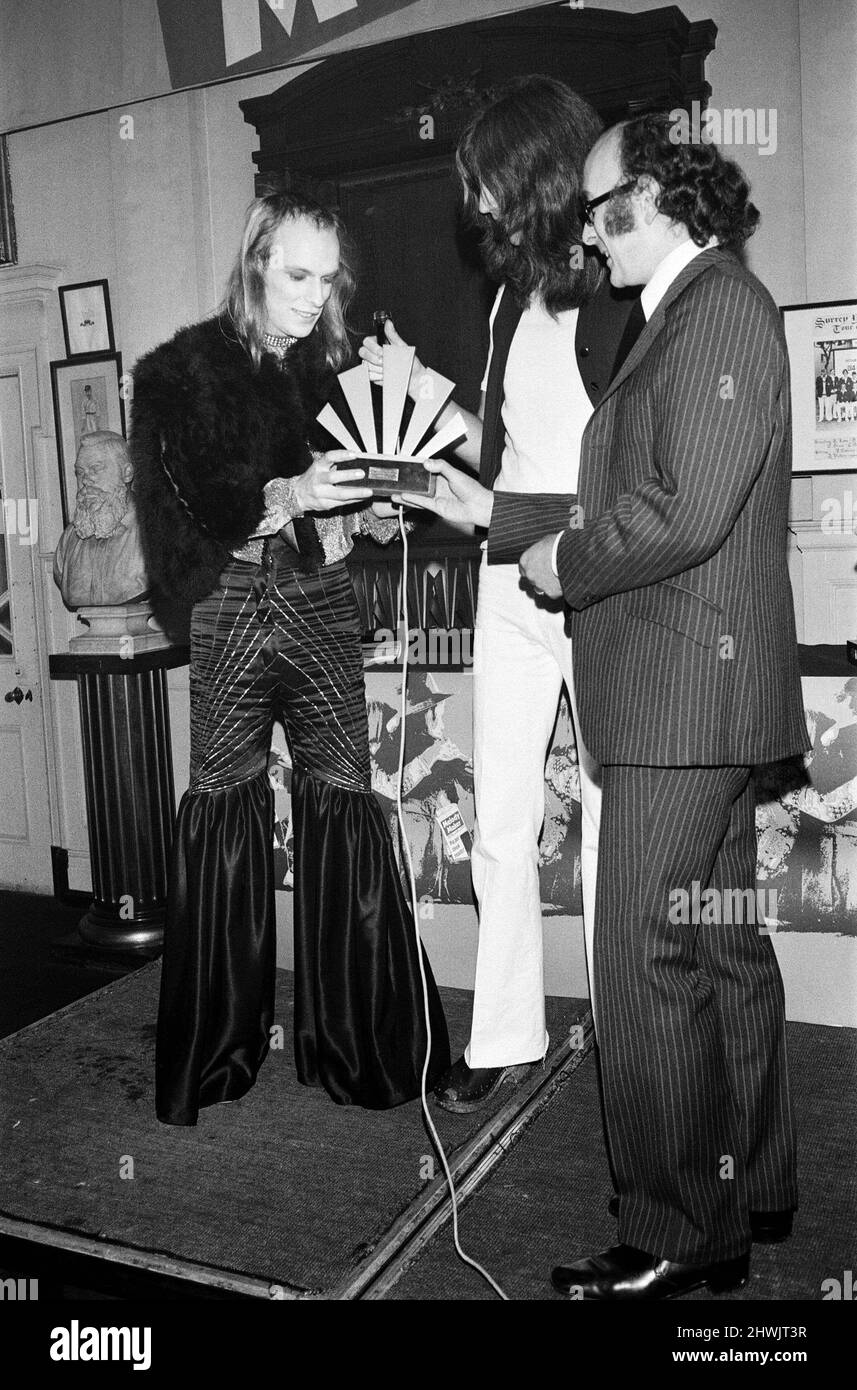 Brian Eno holding receiving his awardat The Oval Pop Festival, Oval Cricket Ground, South London.  The festival was sponsored by Music Magazine Melody Maker  Picture taken 30th September 1972 Stock Photo