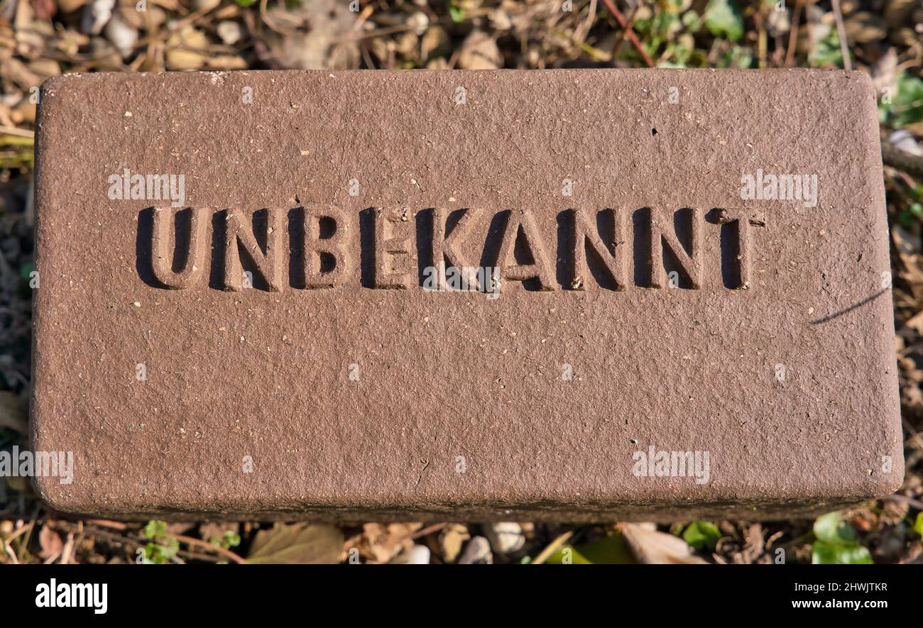 Cemetery grave marker for unknown person with german letters UNBEKANNT Stock Photo