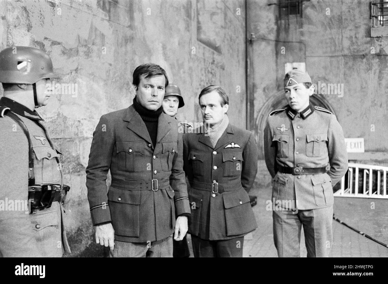 Colditz, Photo-call for new BBC television series, actors pose for the cameras on first day of filming, Ealing Studios, London, 19th June 1972.  Pictured, Robert Wagner as Flight Lieutenant Phil Carrington and David McCallum as Flight Lieutenant Simon Carter. Stock Photo