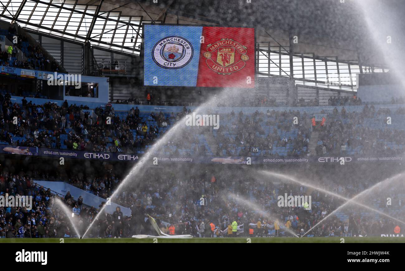 Manchester, England, 6th March 2022.   Both teams badges on the large screen announcing the Manchester derby match during the Premier League match at the Etihad Stadium, Manchester. Picture credit should read: Darren Staples / Sportimage Credit: Sportimage/Alamy Live News Stock Photo