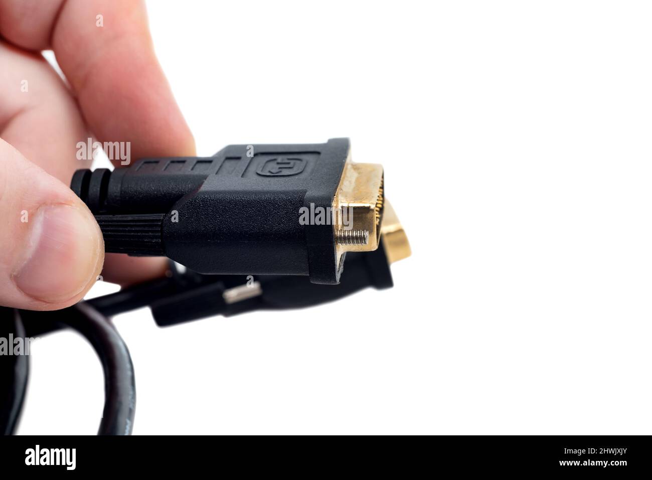 Hands holding a cable to connect to a monitor or TV. VGA cable to adapter Stock Photo Alamy