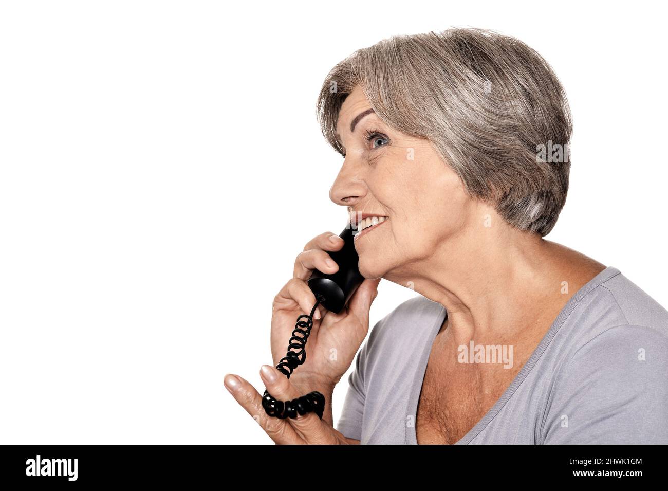 Portrait of beautiful senior woman talking on phone Stock Photo - Alamy