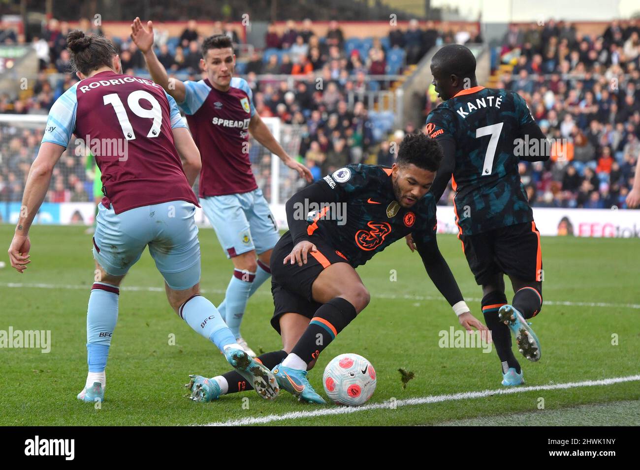 Chelsea’s Reece James and Burnley’s Jay Rodriguez battle for the ball during the Premier League match between Burnley FC and Chelsea FC at Turf Moor, Burnley, UK. Picture date: Saturday March 5, 2022. Photo credit should read: Anthony Devlin Stock Photo