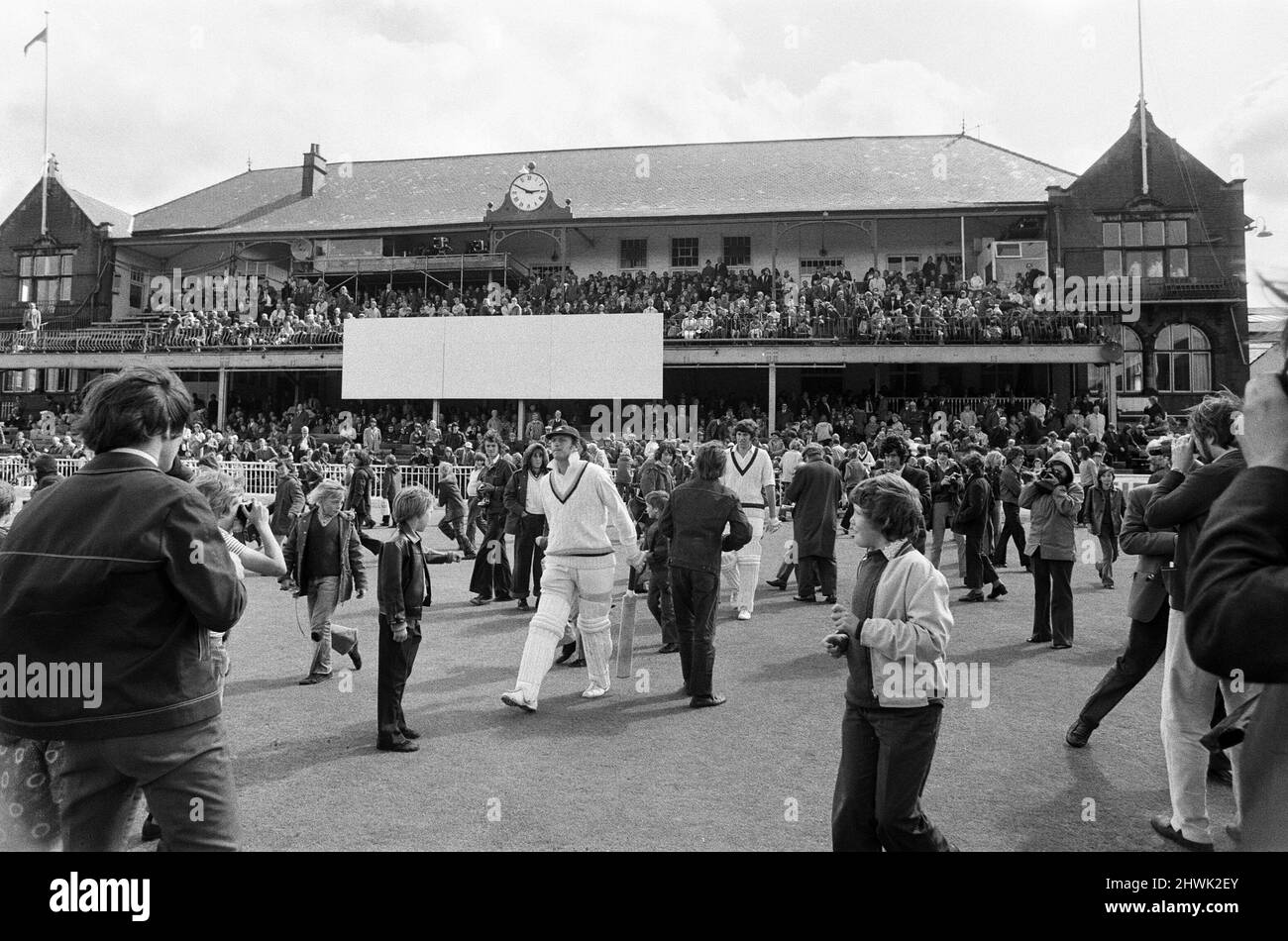 The final first class match to be held at Bramall Lane, Sheffield, the County Championship match between home team Yorkshire and Lancashire. Yorkshire batsman Geoffrey Boycott on the field as crowds rush on.  7th August 1973. Stock Photo