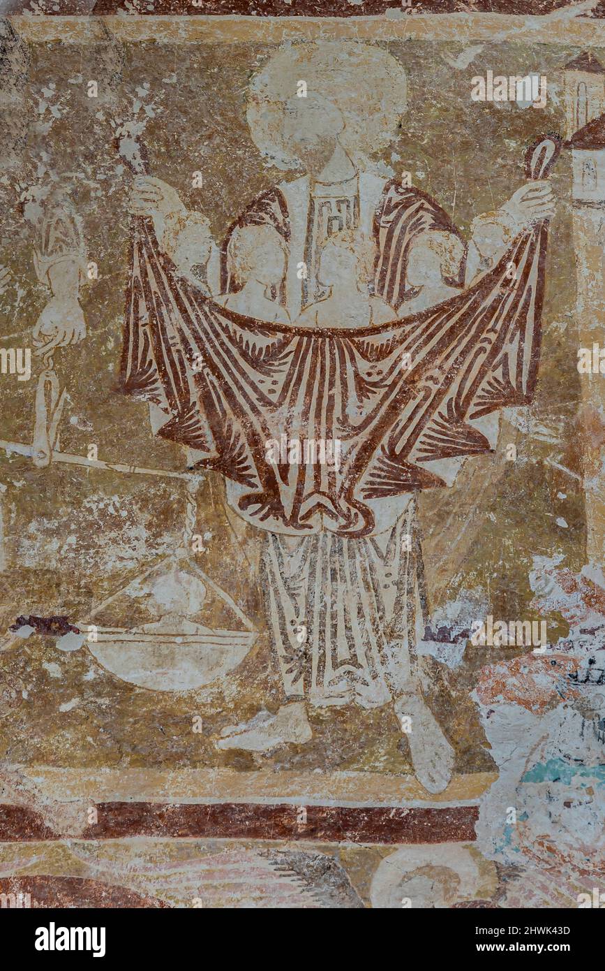 Fresco from the 1300s depicting Abraham holding the saved souls in a cloth and the archangel Michael weighs them in a scale, Orslev church, Denmark, A Stock Photo