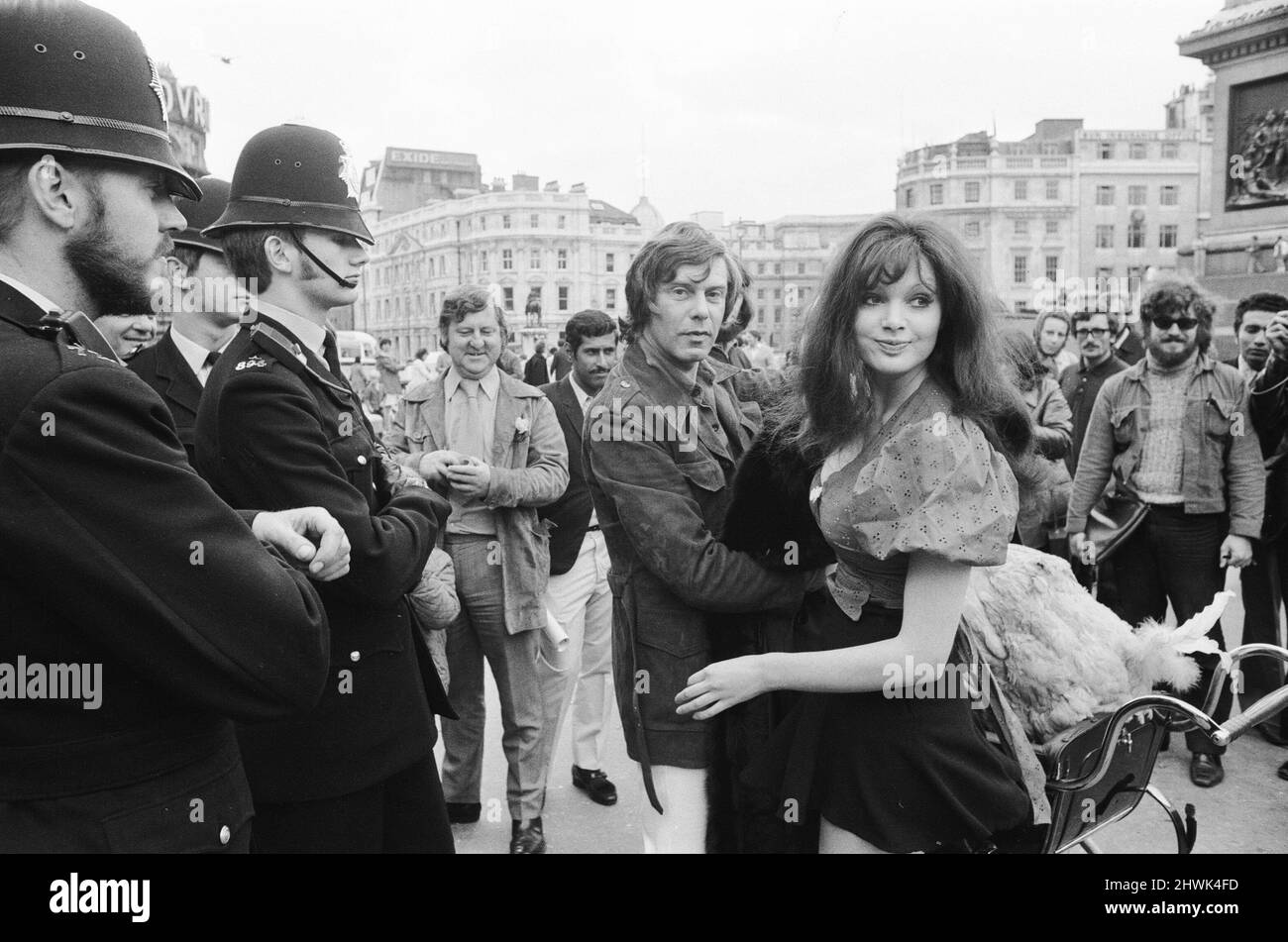 Actress and former model Madeline Smith was forcibly moved on by the law in company with a dodo in a pram in Trafalgar Square. She was advertising a sale of rare, stuffed natural history specimens for a friend who runs the British Natural History Company. Here she is pictured with Digby the Dodo in Trafalgar Square being escorted by three policemen. 24th September 1972.  *** Local Caption *** Maddy Smith Stock Photo