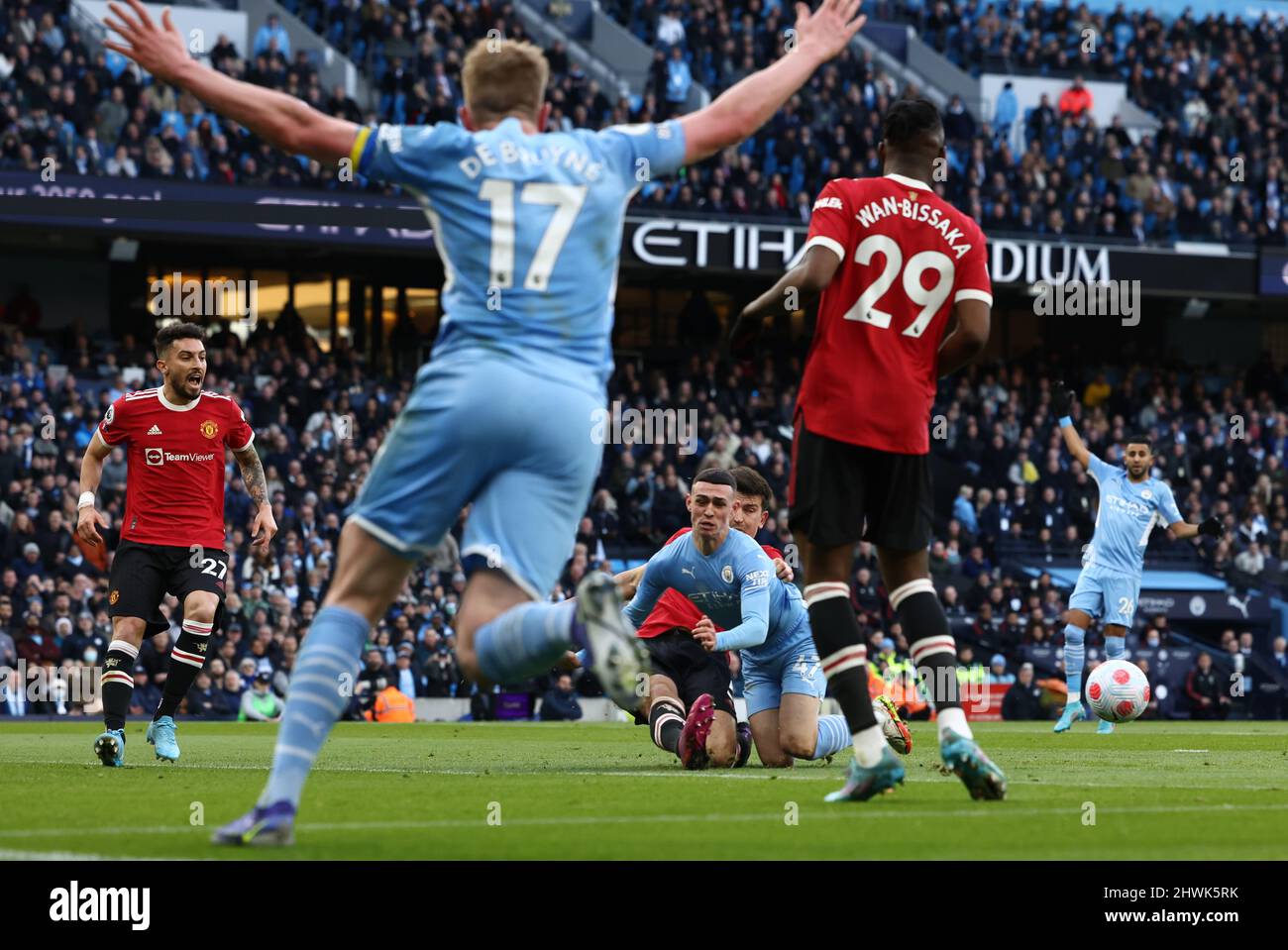 Manchester, England, 6th March 2022.   Kevin De Bruyne of Manchester City claims a penalty as Phil Foden of Manchester City is tackled by Harry Maguire of Manchester United during the Premier League match at the Etihad Stadium, Manchester. Picture credit should read: Darren Staples / Sportimage Credit: Sportimage/Alamy Live News Stock Photo