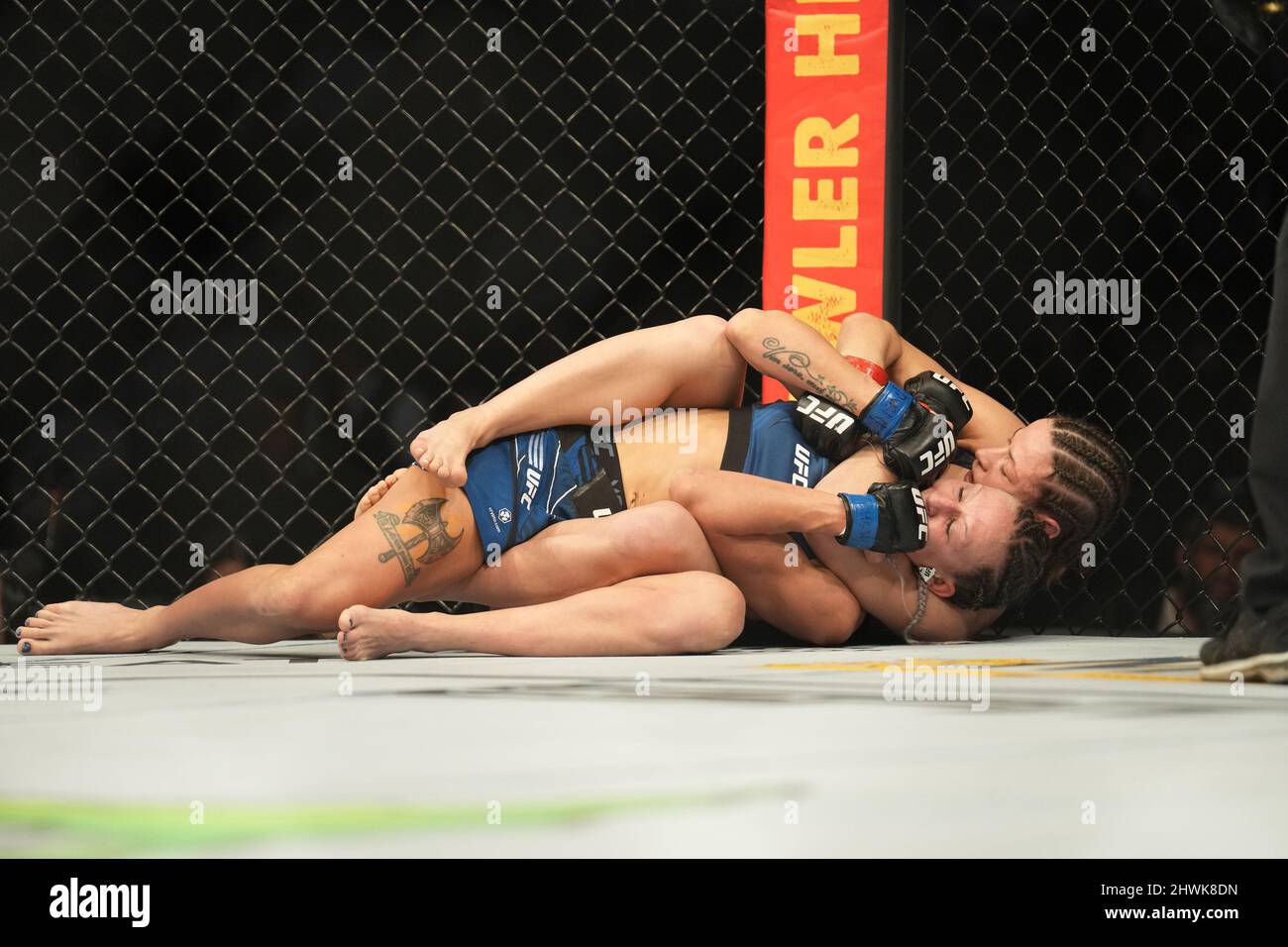 Las Vegas, Nevada, USA. 05th Mar, 2022.  Maryna Moroz (back) attempts to submit Mariya Agapova in their Women's Flyweight bout at T-Mobile Arena for UFC 272: Covington vs Masvidal on March 5, 2022, in Las Vegas, NV, United States. (Credit Image: © Louis Grasse/PX Imagens via ZUMA Press Wire) Credit: ZUMA Press, Inc./Alamy Live News Stock Photo