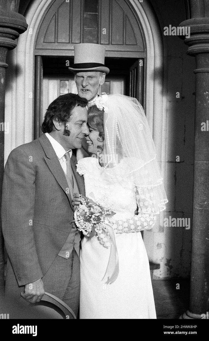 Steptoe and Son, film released 1972, starring Wildred Brambell as Albert Steptoe, Harry H Corbett as his son Harold Steptoe, and Carolyn Seymour as wife Zita, pictured on location at St John's Church, Ladbroke Grove, London, Thursday 28th October 1971. Stock Photo