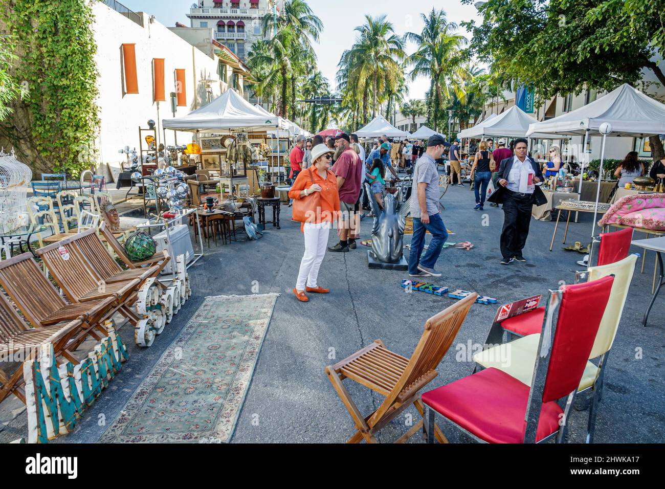 Miami Beach Florida,Lincoln Road,pedestrian mall arcade,shopping shoppers,antique collectible vendors market marketplace furniture chairs display sale Stock Photo