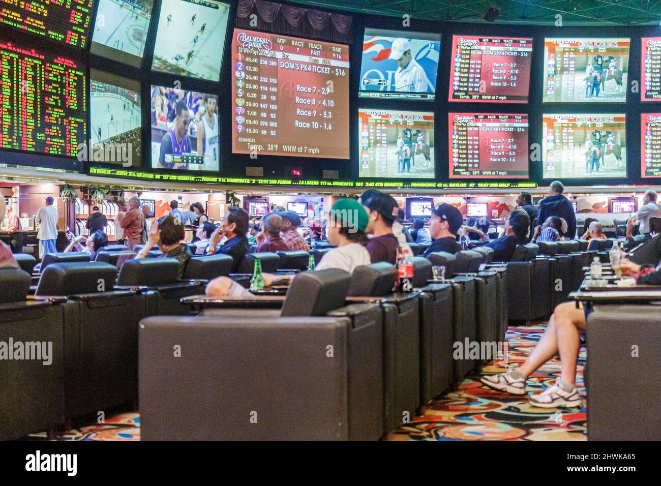Las Vegas Nevada,Westgate Las Vegas Resort & Casino,sporting events sportsbook,betting odds gamblers gambling monitors live watching inside interior Stock Photo