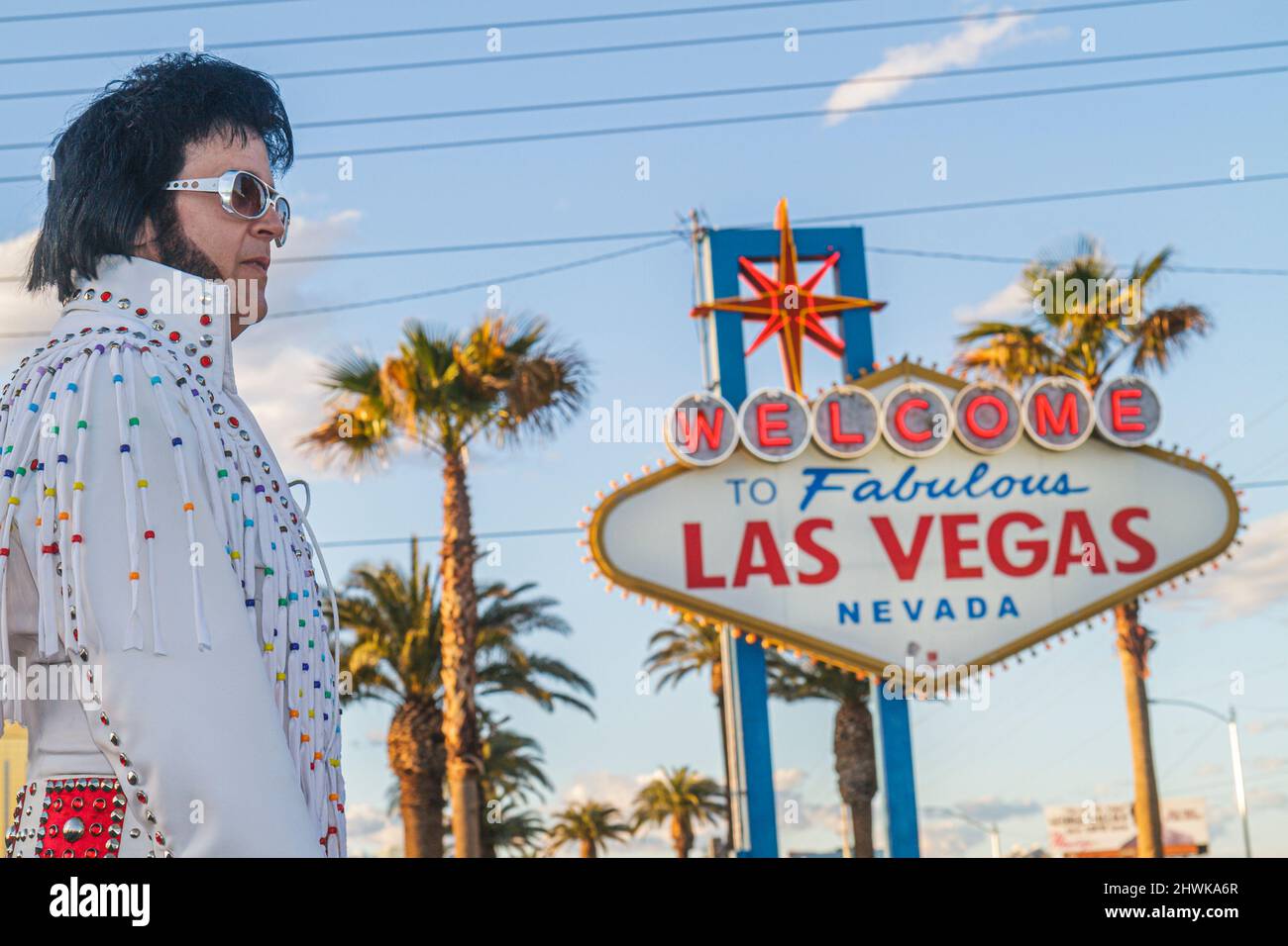 Las Vegas Nevada,South Las Vegas Boulevard Strip,Welcome to Fabulous Las Vegas sign historic,man male Elvis Presley impersonator celebrity look-alike Stock Photo