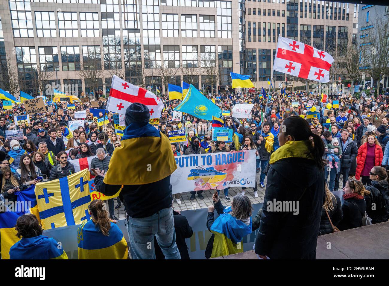 Brussels, Belgium. 06th Mar, 2022. Demonstrators seen waving Ukrainian,  Georgian and Kazakh flags during the demonstration. Thousands of people  joined the demonstration in solidarity with Ukraine in the capital of  Belgium. They