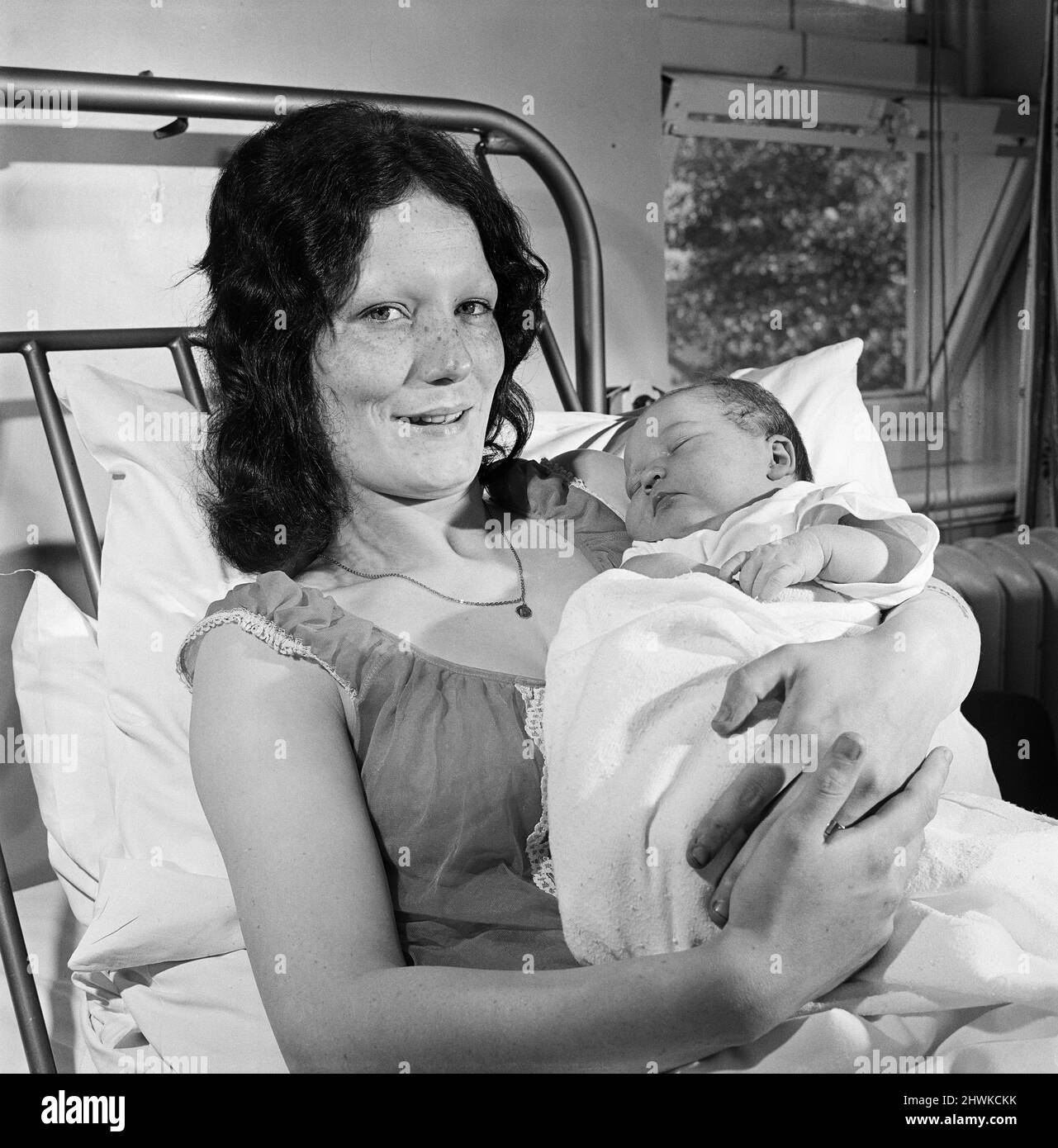 A mother holding a baby at Carter Bequest hospital. Circa 1973. Stock Photo