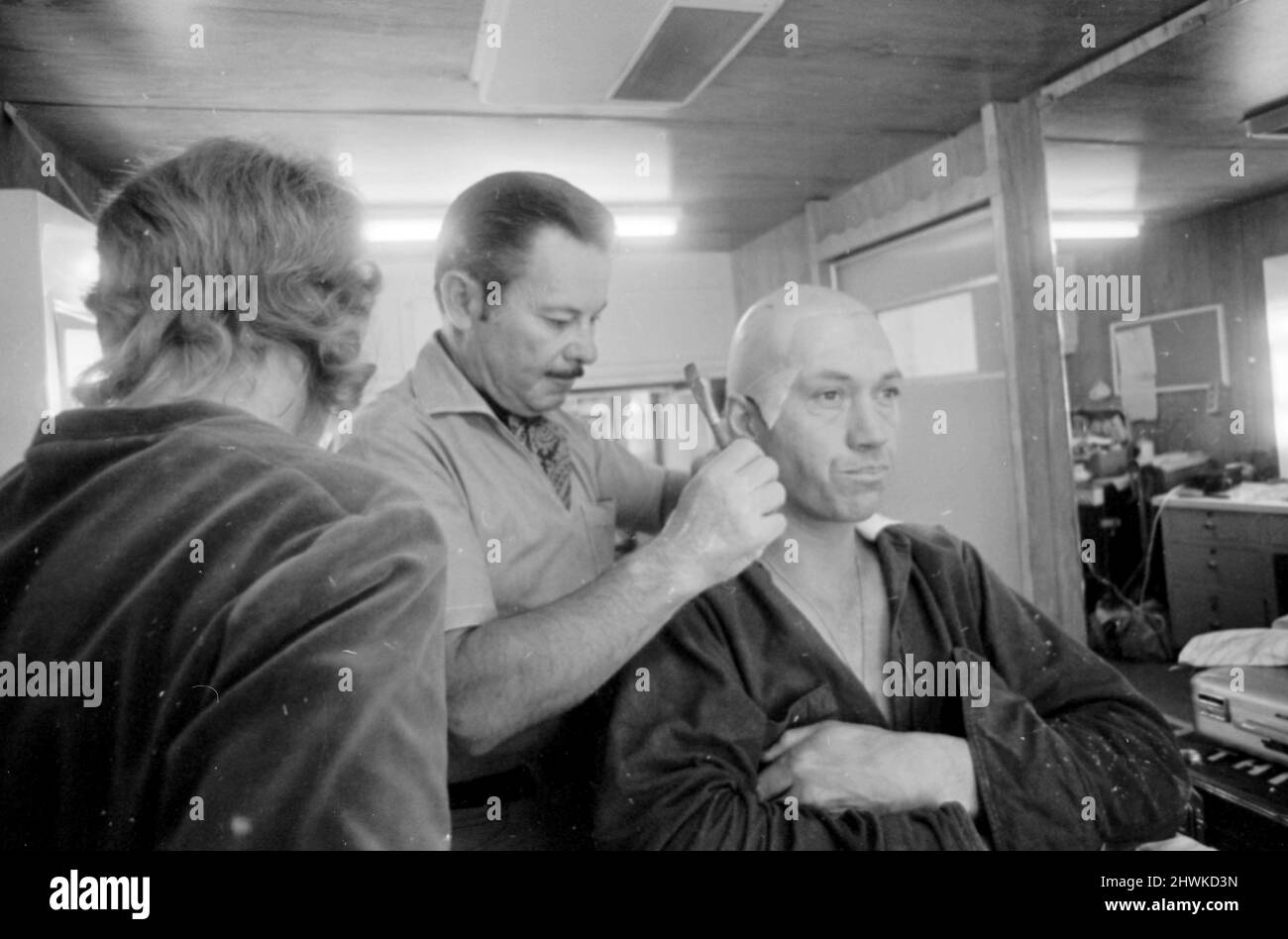 David Carradine actor has his makeup applied on set of TV programme Kung Fu (1972-1975), piictured November 1973.   Kung Fu follows the adventures of a Shaolin monk, Kwai Chang Caine who travels through the American Old West armed only with his skill in martial arts, as he seeks his half-brother, Danny Caine.   *** Local Caption *** Grasshopper Stock Photo