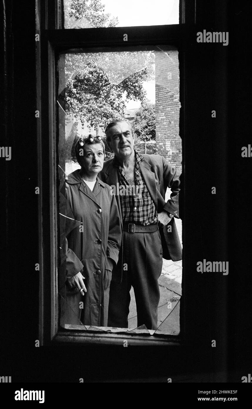 Bernard Youens and Jean Alexander who play Stan Ogden and wife Hilda in Granada TV's Coronation Street paid a nostalgic visit to the real street (Archie Street) in Salford, which is being demolished. 5th August 1971. Stock Photo