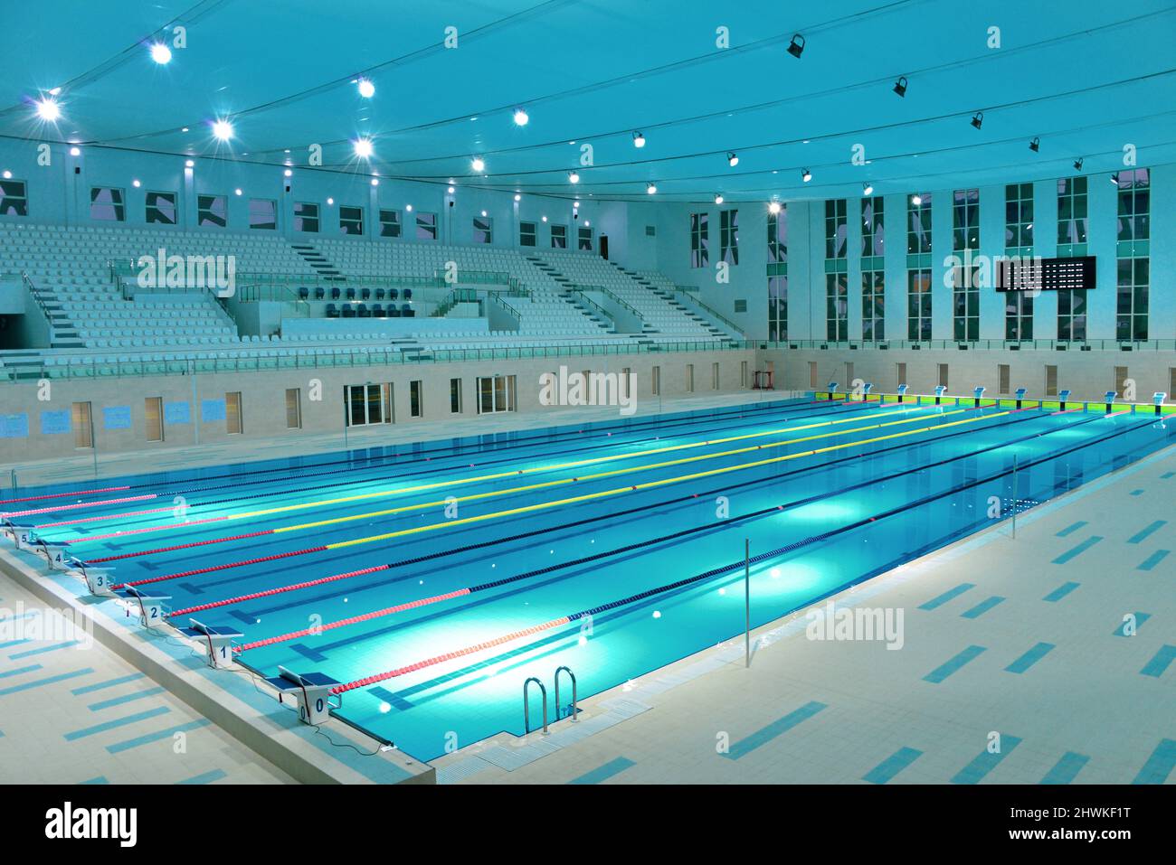 Interior details of lanes and seating in Olympic sized swimming pool