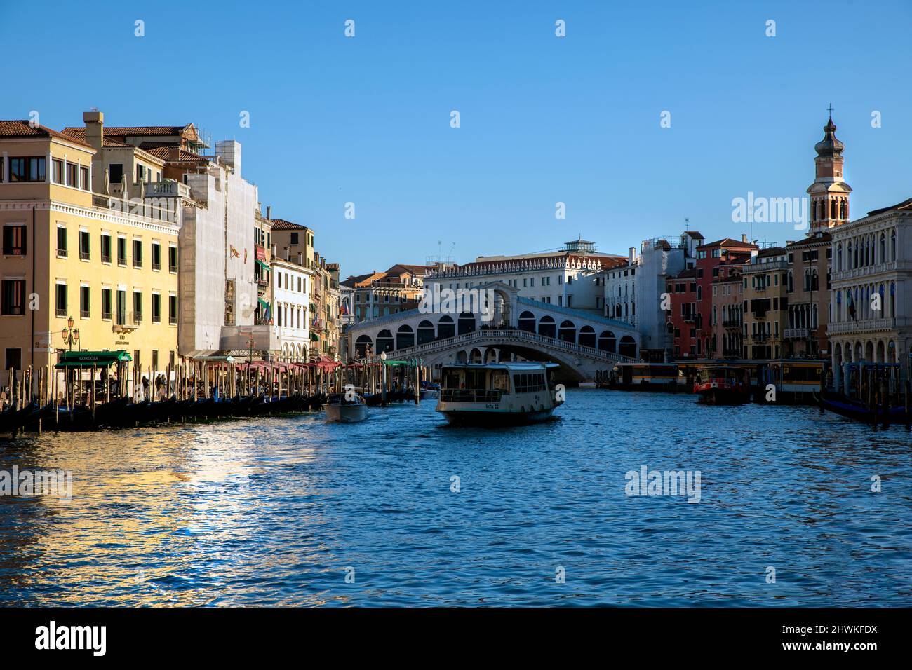 Waterbus and the Rialto Bridge on the Grand Canal, Venice Stock Photo