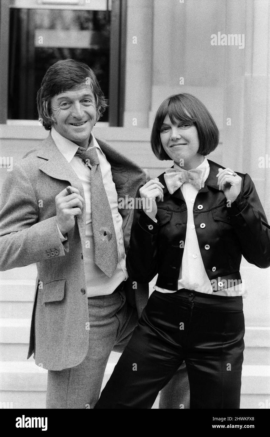 Mary Quant launched her new range of neckwear at the Savoy Hotel in London. It is the first time she has designed for men and the collection includes ties and bow ties in unusual fabrics and colours. Mary Quant is pictured with Michael Parkinson wearing the new designs. 12th September 1972. Stock Photo