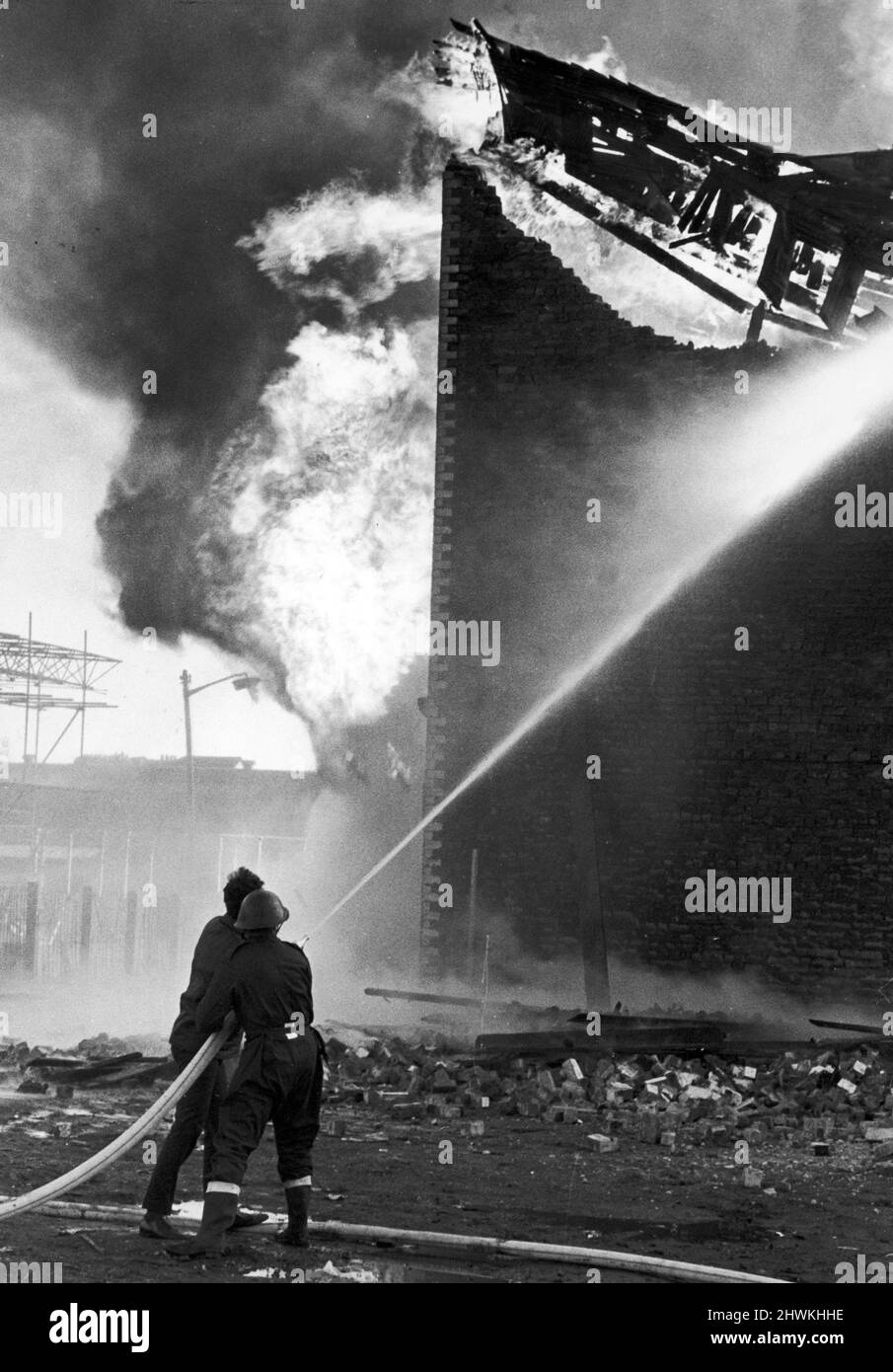 Fire at disused jute works off Gallowgate in the East End, Glasgow, October 1973. Fire is being tackled by stand-in firefighters from the Army, Navy and Airforce. Stock Photo