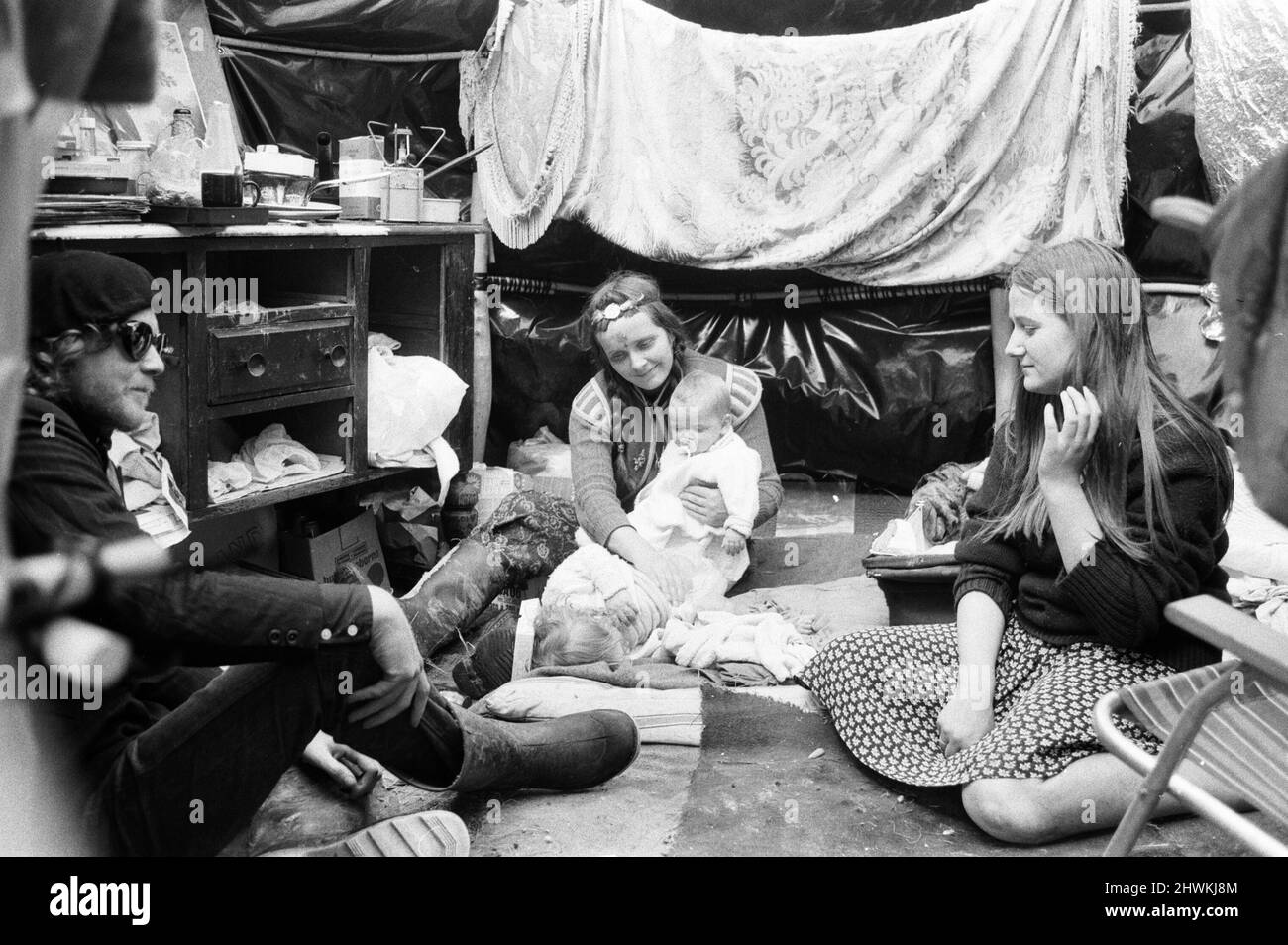 The Glastonbury Fayre of 1971, a free festival planned by Andrew Kerr and Arabella Churchill .Picture shows: Hippies inside their rain igloo at the festival. 19th June 1971. Stock Photo