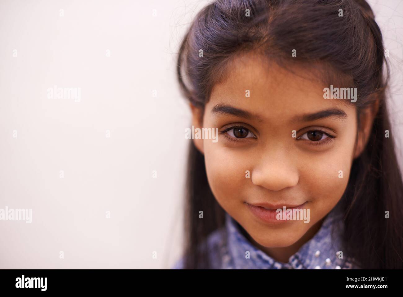 cutie little girl Shes a cutie. Portrait of a cute little girl smiling Stock Photo - Alamy