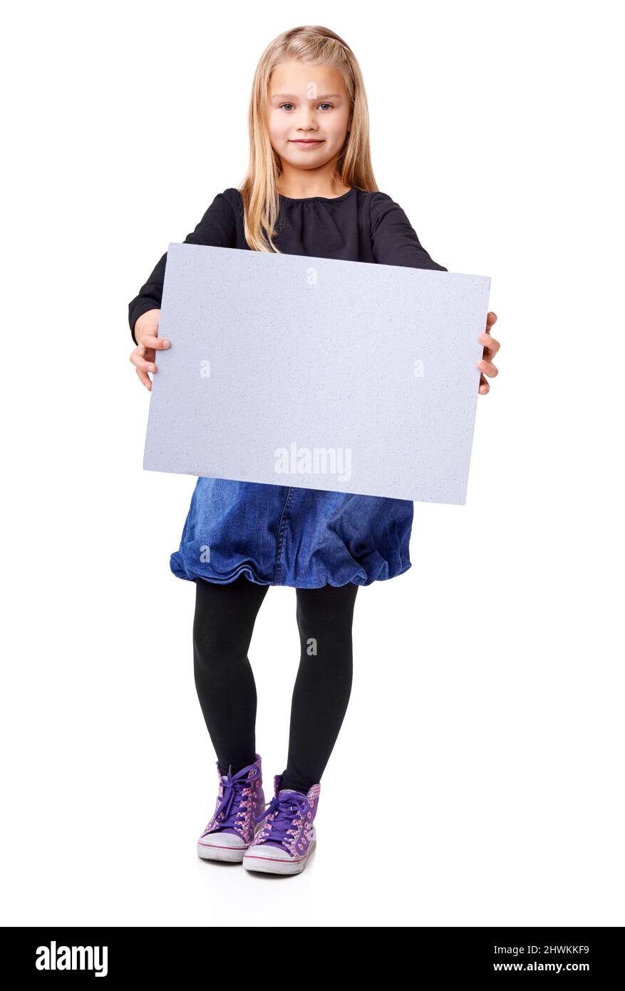 Hey, Ive got an opinion too. Studio shot of a young girl holding up a blank sign for copyspace. Stock Photo