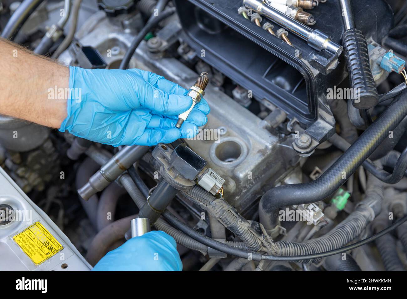 Mechanic changing car spark plugs Stock Photo Alamy