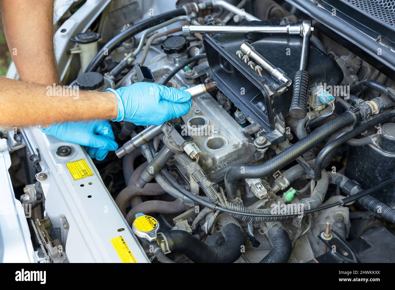 Mechanic changing car spark plugs Stock Photo Alamy