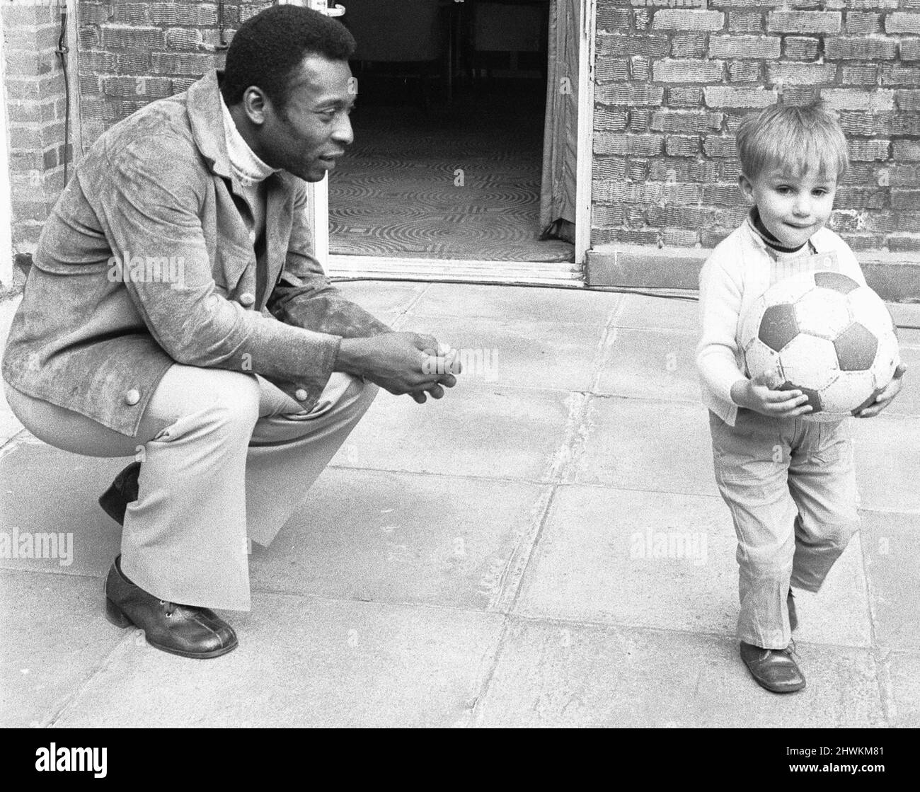 Pele meets Pele. A two and a half year old from Shepherds Bush named Pele Jairzinho Johnson by his football mad father Tony Johnson, seen here meeting his namesake. Pele was in London with the rest of the Santos football team for a match against Fulham at Craven Cottage. 11th March 1973 Stock Photo