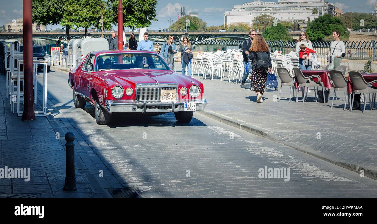 Classic car in the street. Red Chrysler Cordoba. Stock Photo
