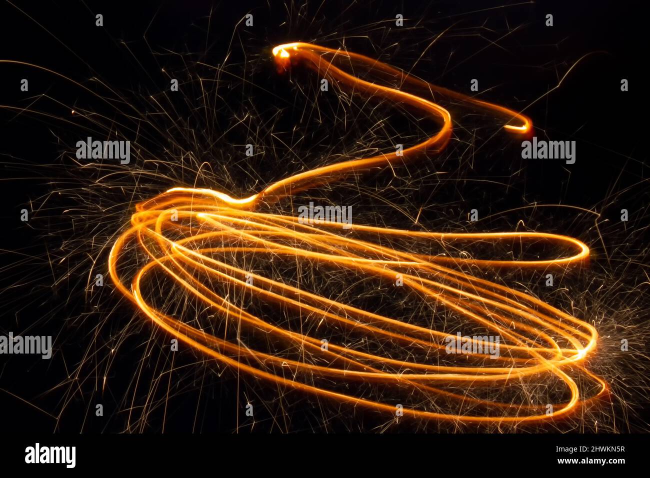 Sparks of sparkler in motion at long exposure Stock Photo