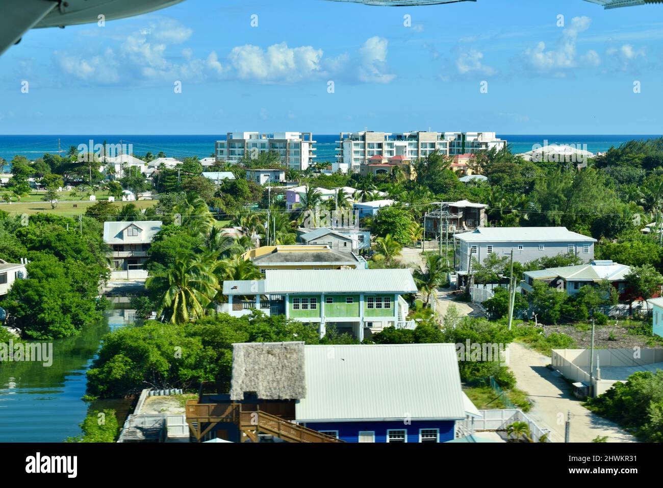 An aerial view of south San Pedro with the lagoon on the left and Alaia resort and the Caribbean Sea in the background. Stock Photo