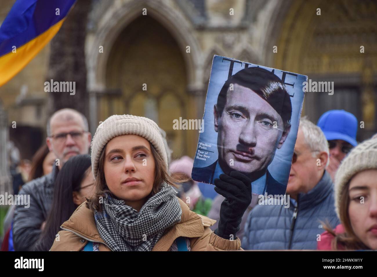 London, England, UK. 6th Mar, 2022. A protester holds a cover of Time magazine with Vladimir Putin's face changed to resemble Adolf Hitler. Demonstrators gathered in Parliament Square for the twelfth day of protests as Russia continues its attack on Ukraine. (Credit Image: © Vuk Valcic/ZUMA Press Wire) Credit: ZUMA Press, Inc./Alamy Live News Stock Photo