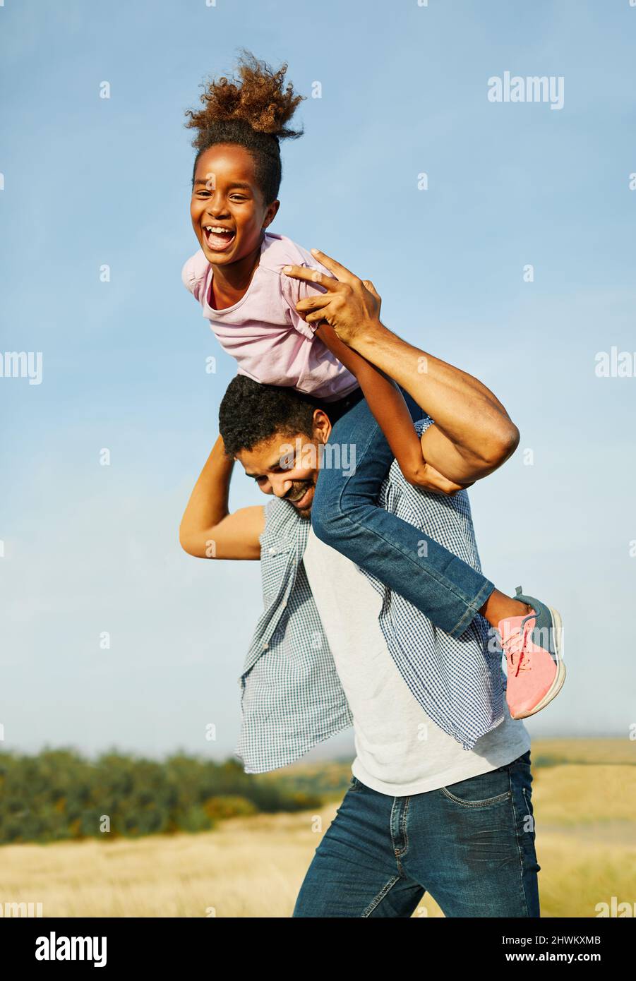 child daughter family happy single father love fun together girl cheerful field outdoor natue summer Stock Photo