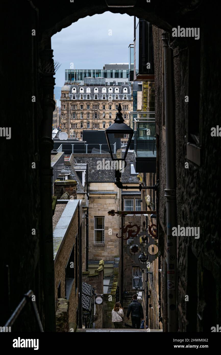 View down Advocate's Close or alley with old fashioned lantern, lamp or streetlight, Edinburgh, Scotland, UK Stock Photo