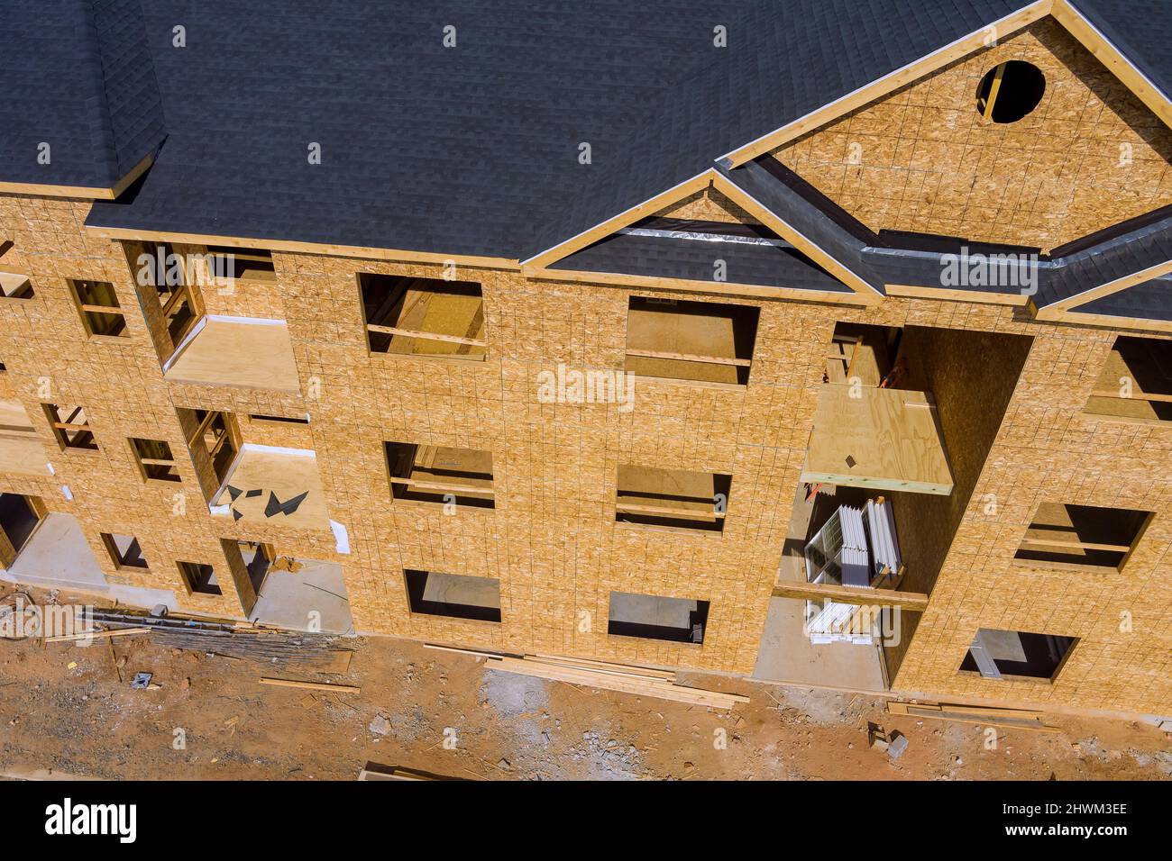 Fragment of a new home under construction wood framing beams Stock Photo