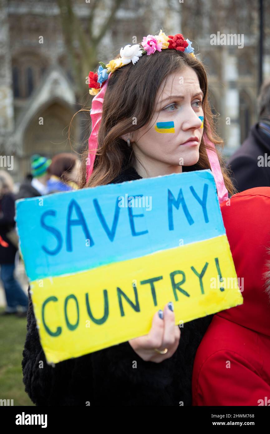 London, UK. 6th March 2022. A Ukrainian woman holds a sign in Parliament Square where people have gathered to protest against Russia's invasion of the Ukraine and to call for an end of the war. Credit: Kiki Streitberger/Alamy Live News Stock Photo