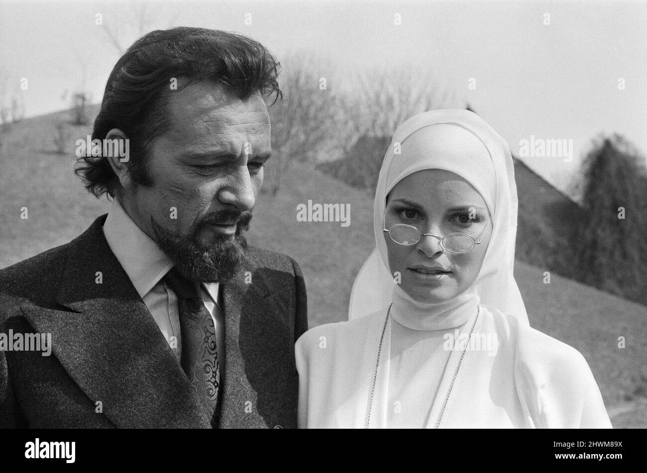 Raquel Welch pictured on set, in Hungary filming her new movie 'Bluebeard'.  Ms Welch plays Sister Magdalena, a novice nun.   The film also stars Richard Burton, pictured here onset with Raquel Welch  Bluebeard is a 1972 film directed by Edward Dmytryk. It stars Richard Burton, Raquel Welch, Joey Heatherton and Sybil Danning. Set in Austria in the 1930s, Bluebeard is a World War I pilot with a reputation as a 'ladykiller' and a frightening blue tinged beard.   Picture taken 19th March 1972 Stock Photo