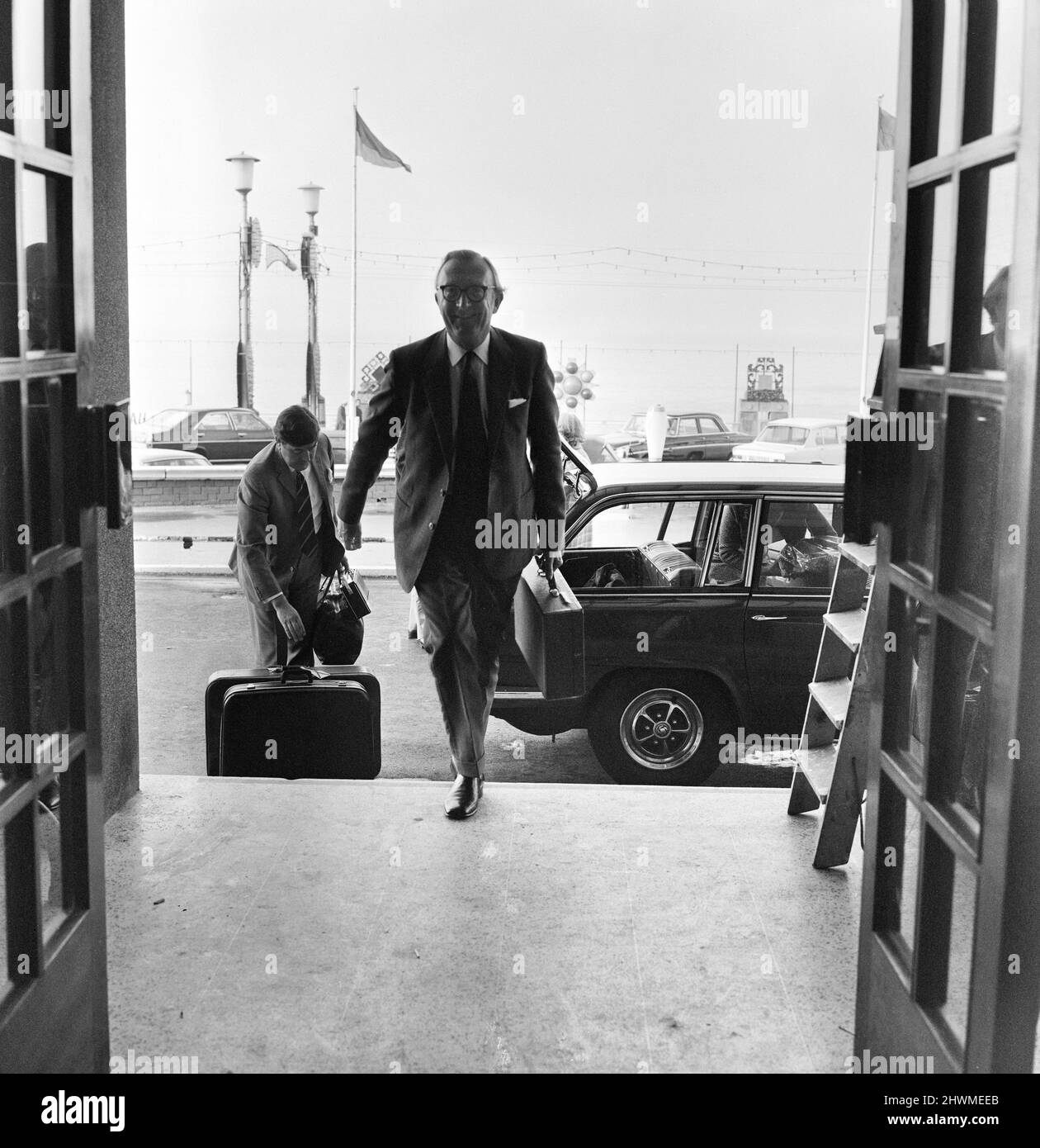 Secretary of State for Defence Lord Carrington arrives with his wife Lady Carrington and all of their baggage at the Imperial Hotel in Blackpool where they are staying during the week of the Conservative Party Conference. October 1972. Stock Photo