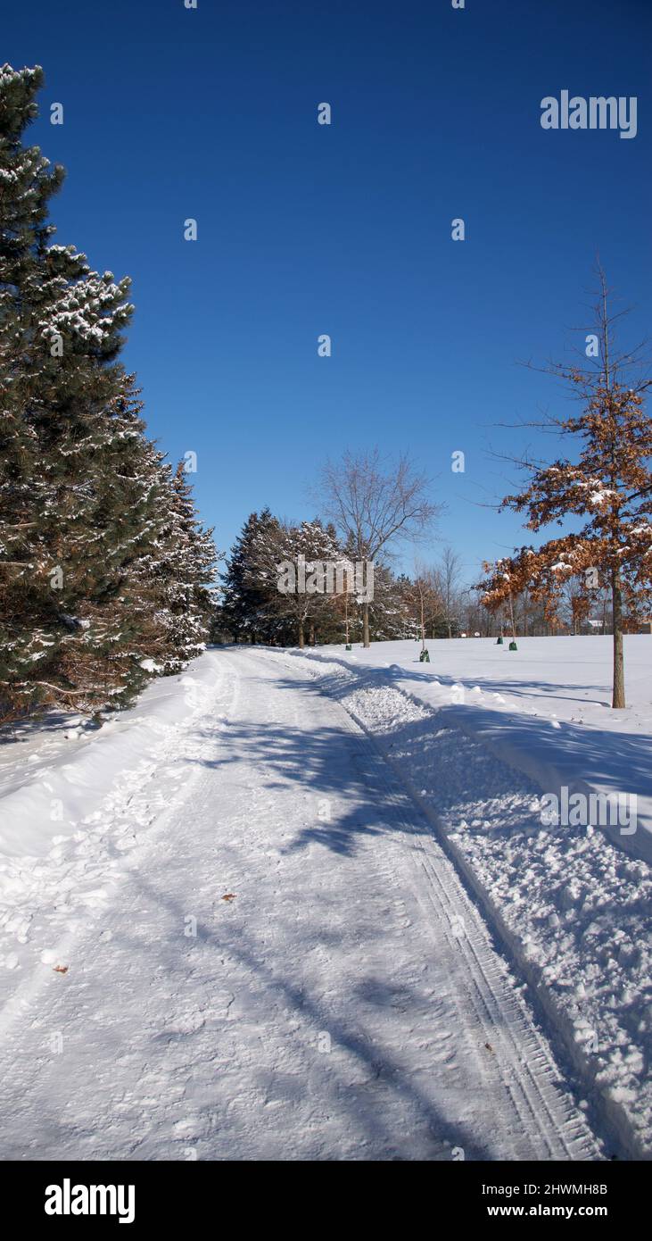 The footpath with deep snow for a winter weather concept. Stock Photo