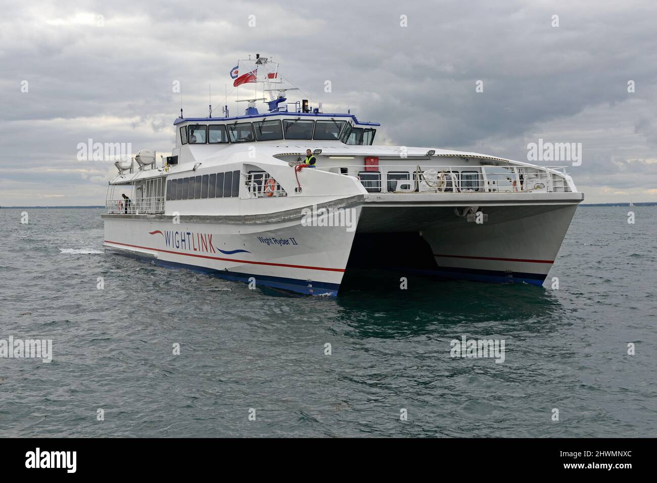 A Wightlink Fastcat catamaran ferry approaches the terminal at the end