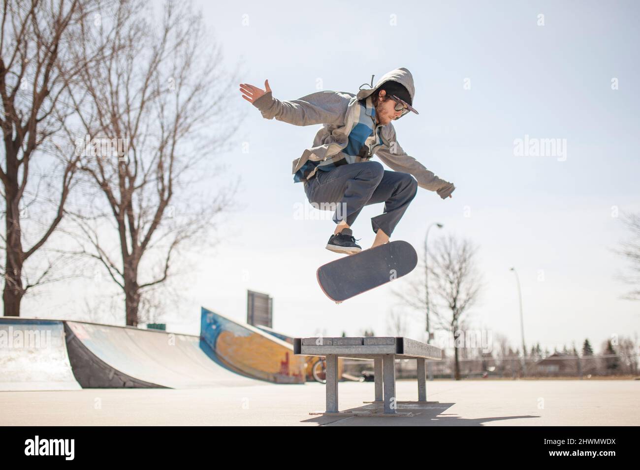Young skateboard enthusiast doing a kickflip Stock Photo