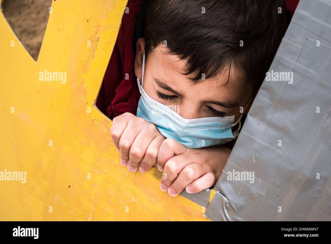 Portrait of a boy with in a medical mask, close eyes expression Stock ...