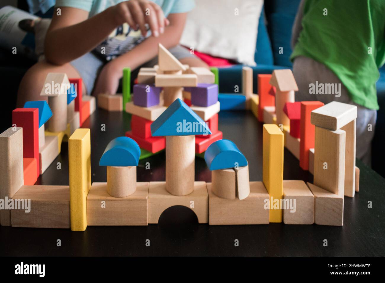 Boy playing with wooden blocks Stock Photo