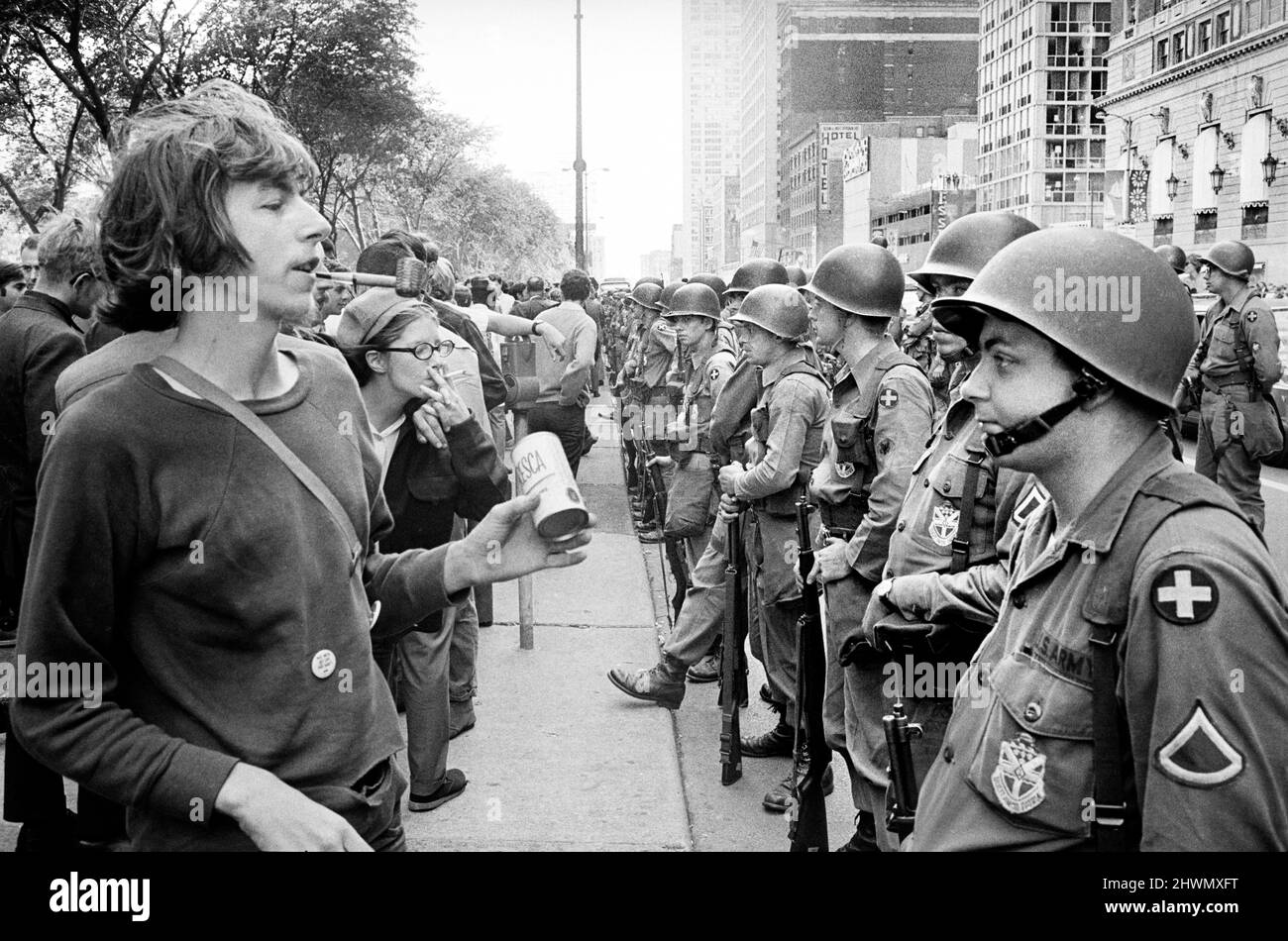 Group of People standing in front of row of National Guard soldiers, across from Hilton Hotel at Grant Park during Democratic National Convention, Chicago, Illinois, USA, Warren K. Leffler, August 26, 1968 Stock Photo